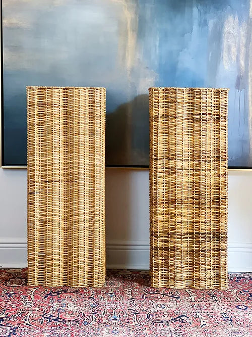 wicker pedestals on a vintage rug