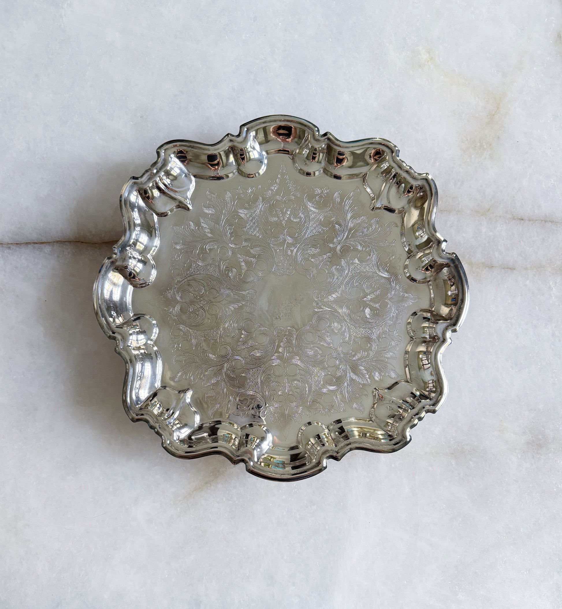 Vintage silver serving footed tray with embossed design
