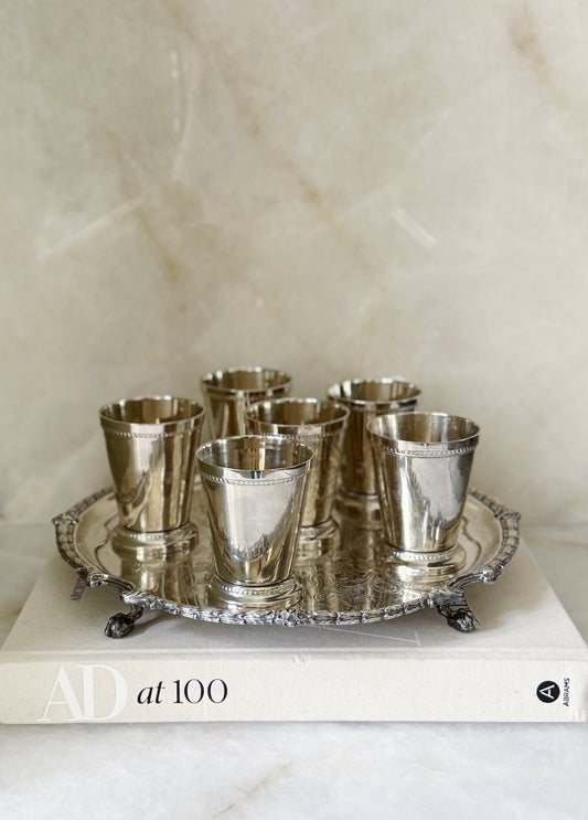 Vintage silver mint julep cups on an antique serving tray