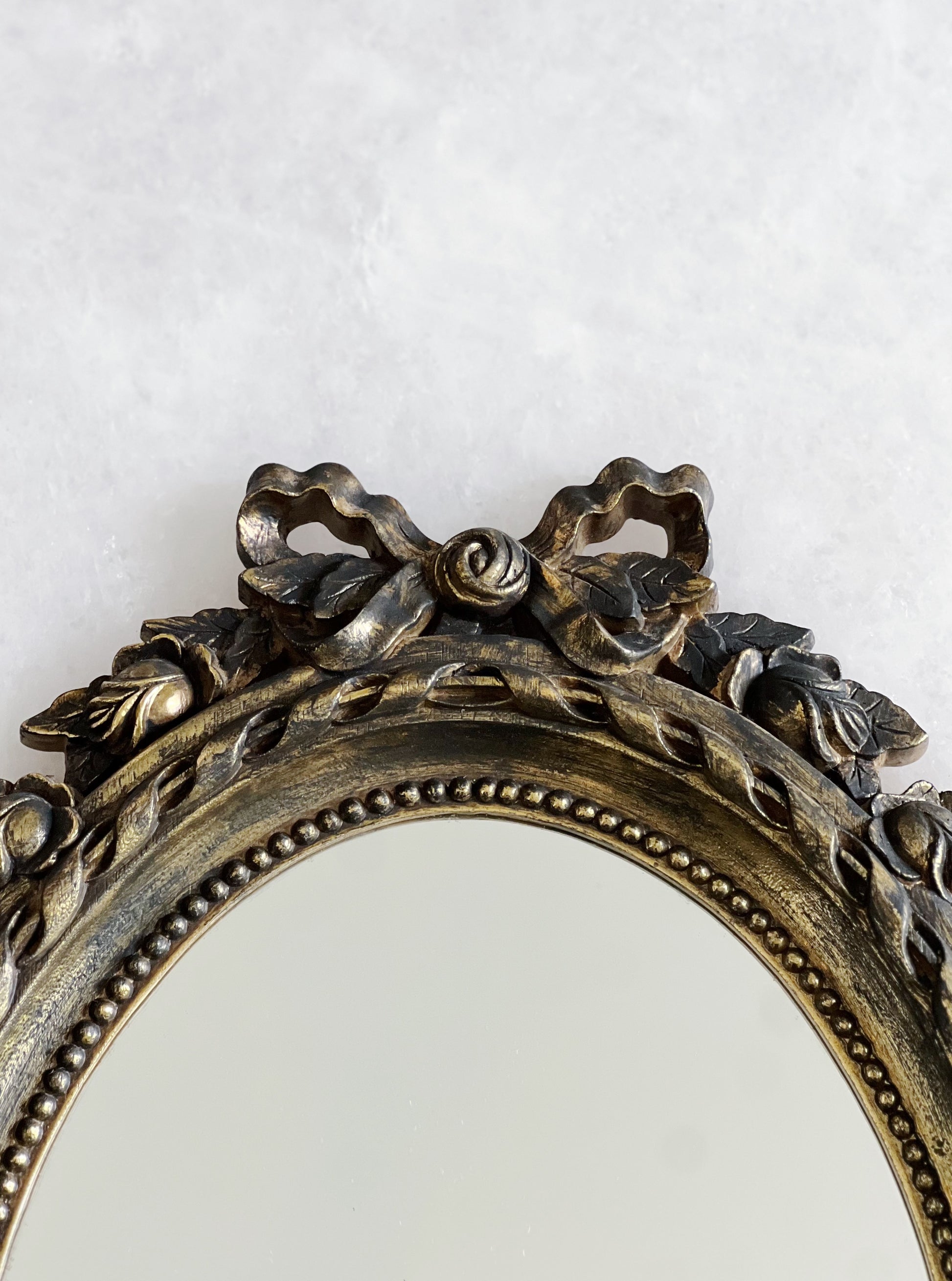 Vintage gold bow mirror