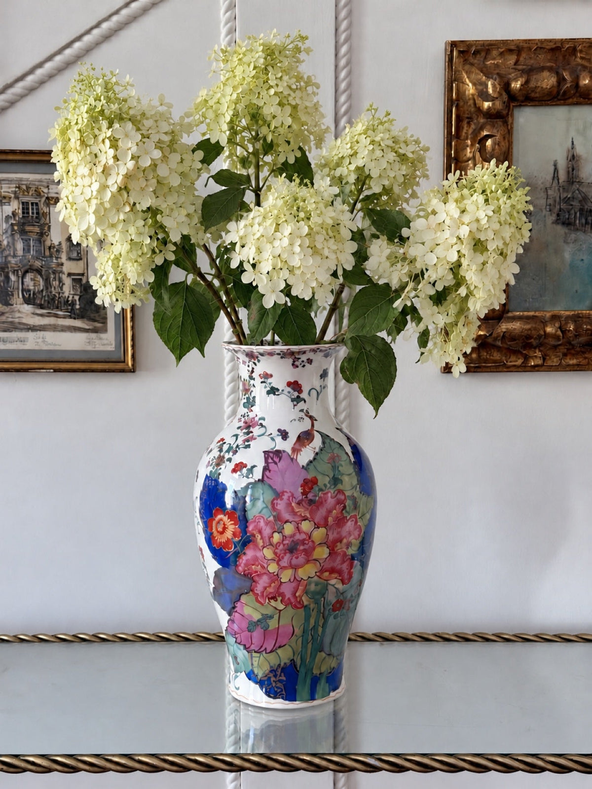 Tobacco leaf porcelain vase styled with white hydrangeas