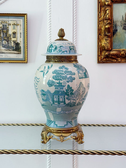Turquoise willow porcelain temple jar with bronze ormolu lid and base, styled on a glass shelf