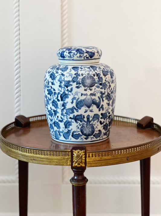 scrolling peonies blue and white ginger jar on wooden table