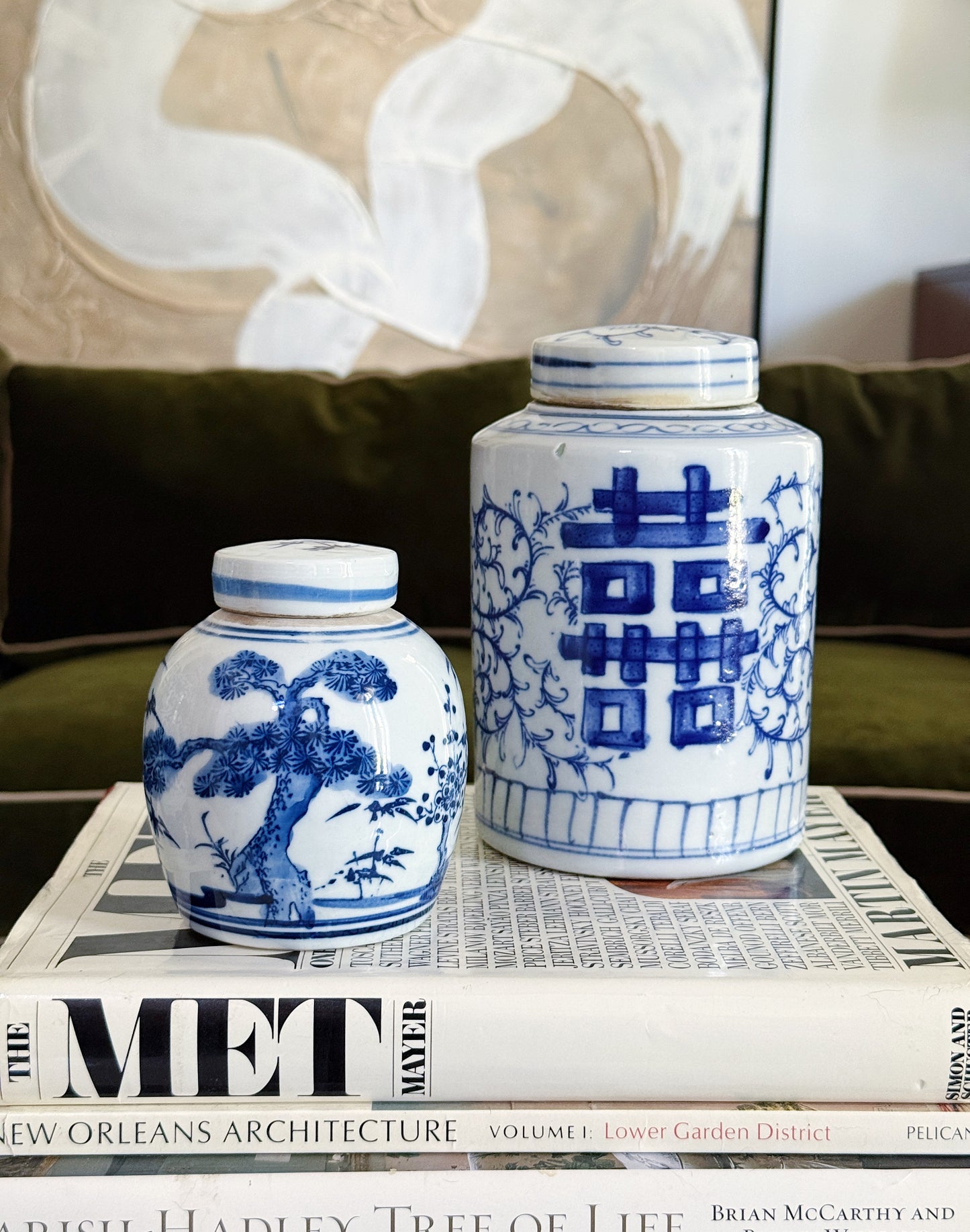 Petite Blue & White Chinoiserie Ginger Jar | Three Friends Motif On vintage coffee table books in a traditional decor home 