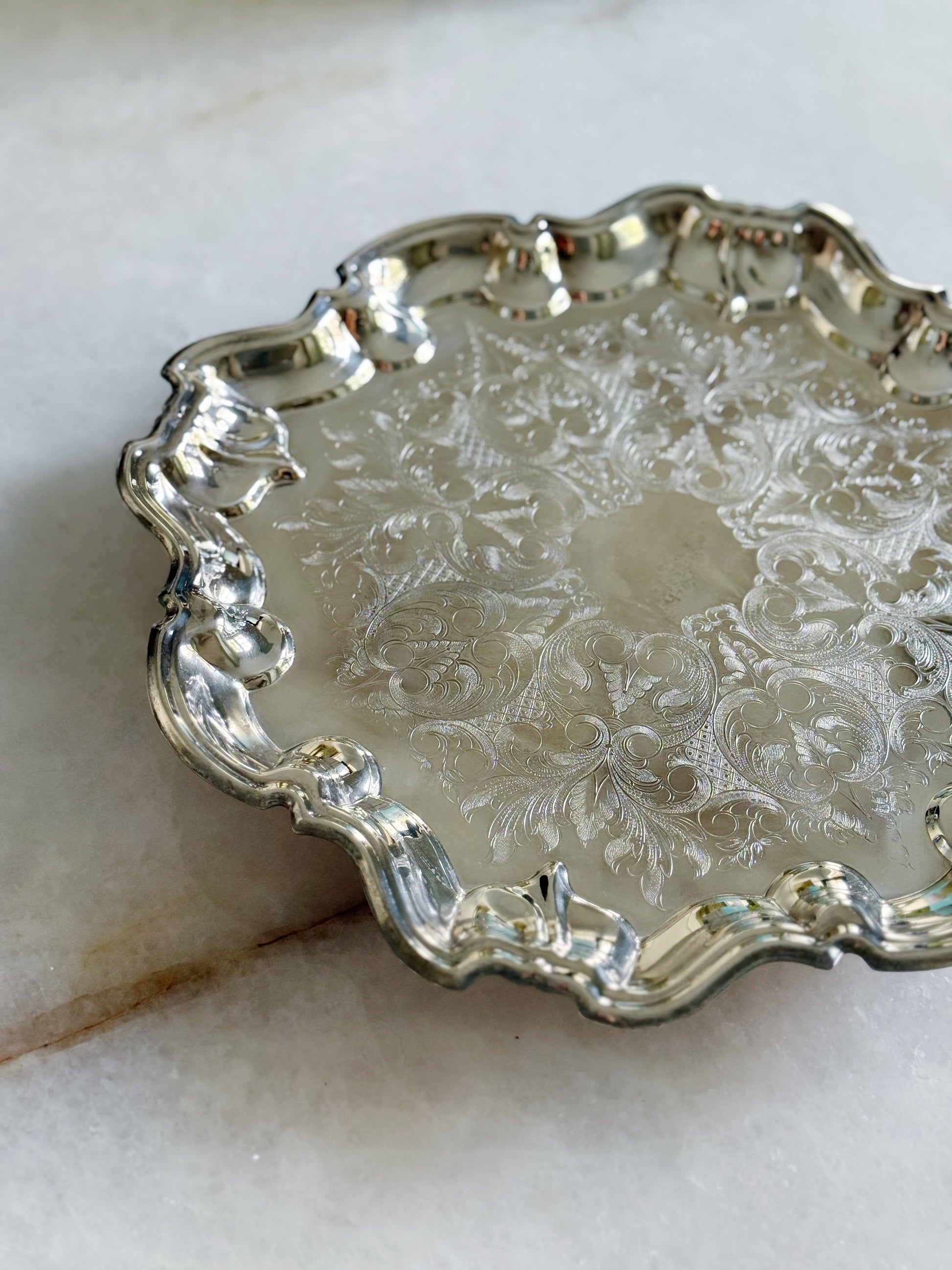 Vintage silver serving footed tray with embossed design