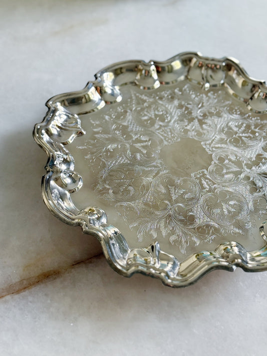 Vintage silver serving footed tray with embossed design