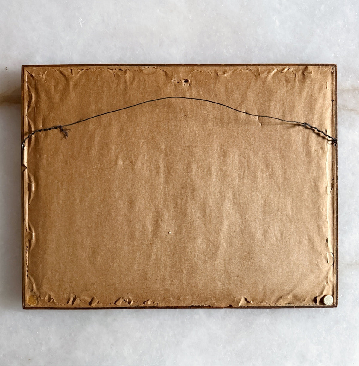 Back of the framed art print with hanging wire