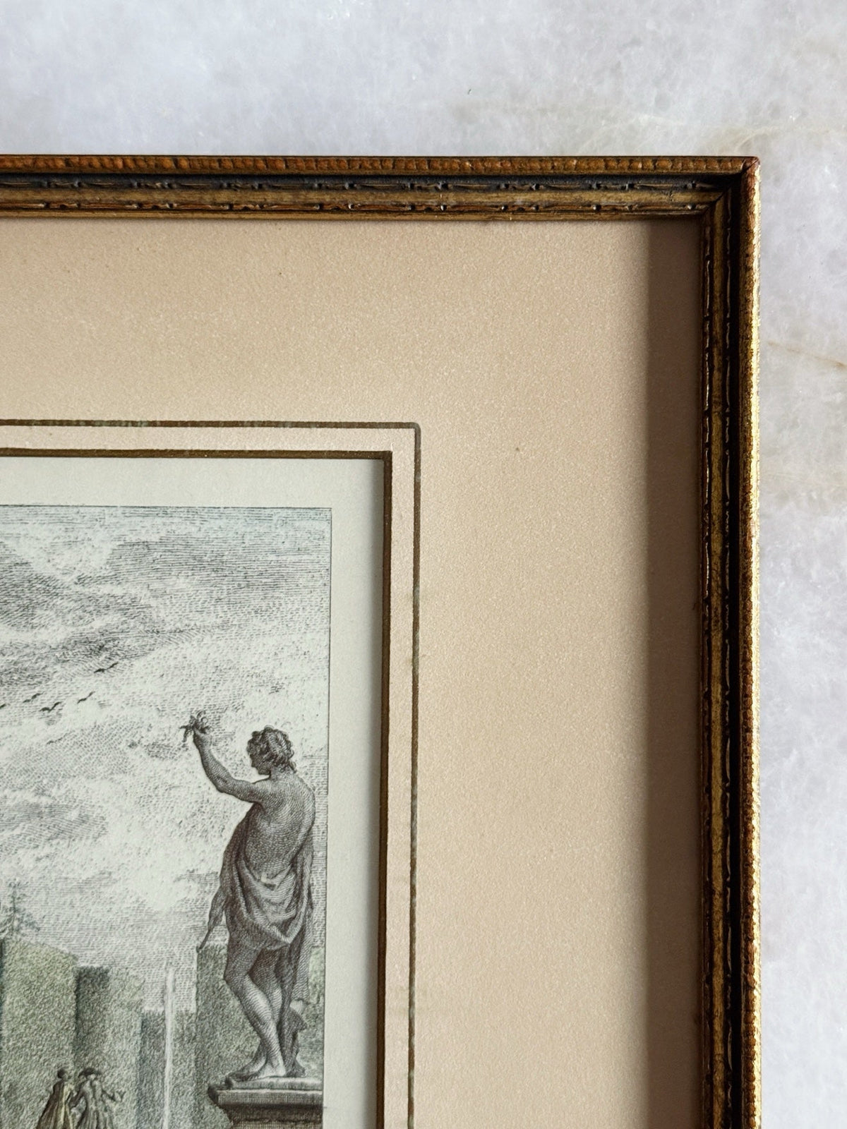 Close-up of the gilt frame edge and matting