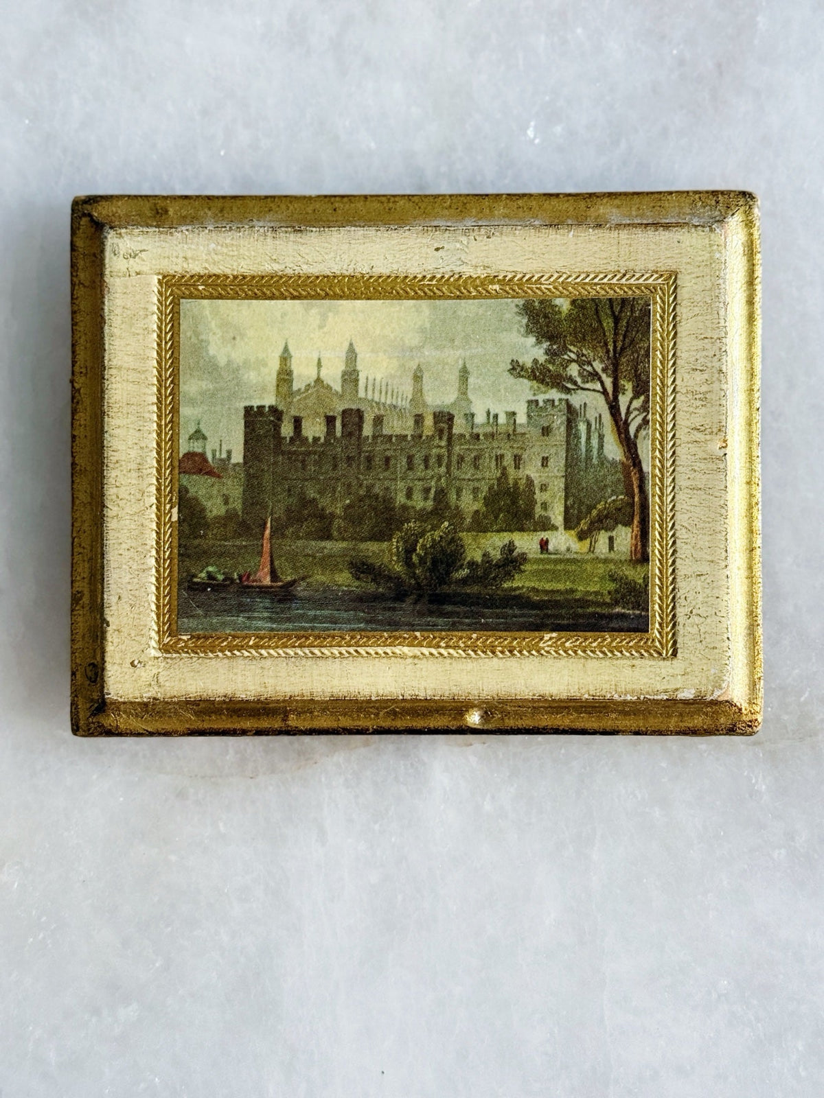 Rectangular Florentine framed print with a castle on the water