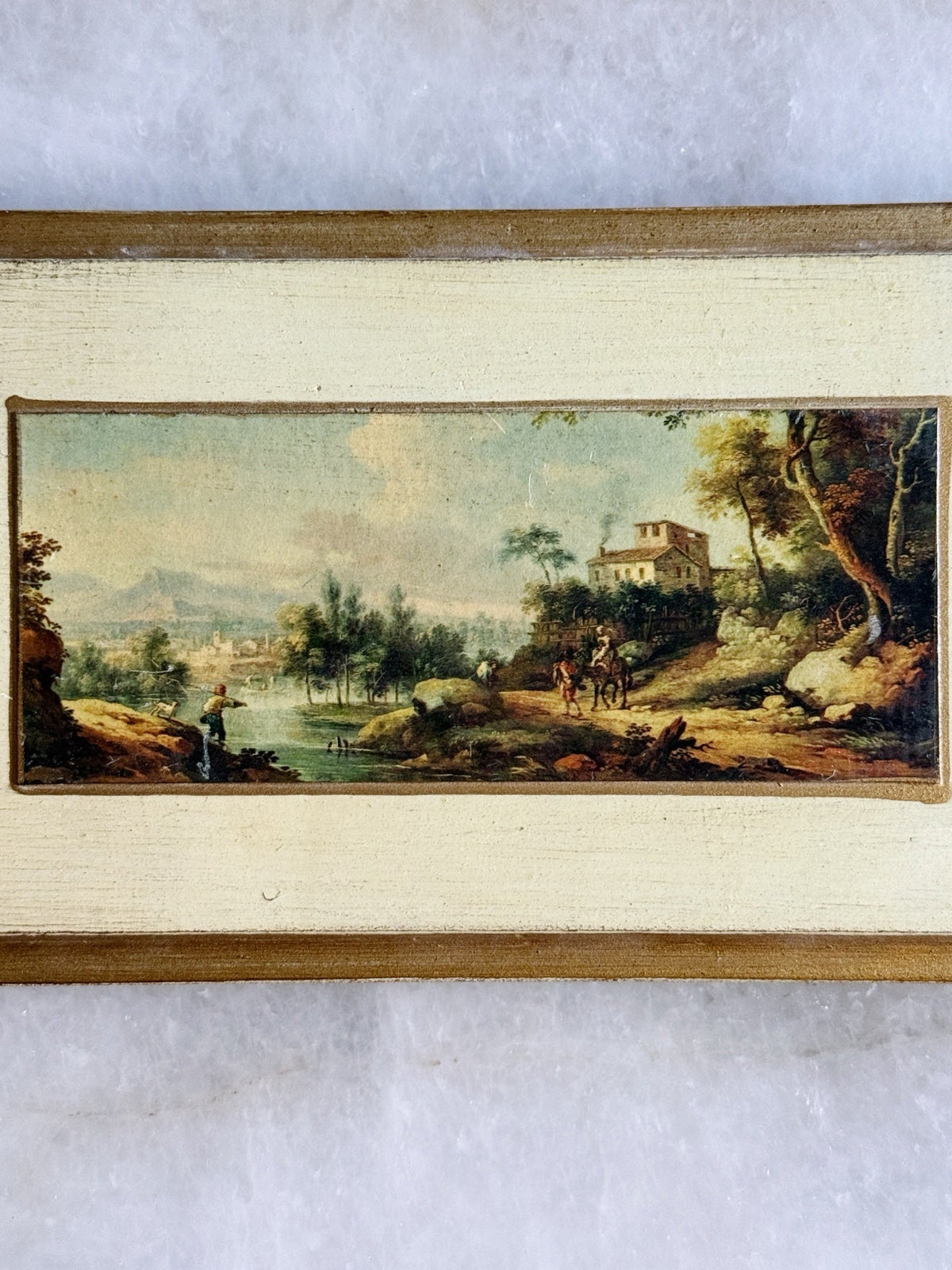 Close-up of the Florentine landscape print and antiqued cream frame