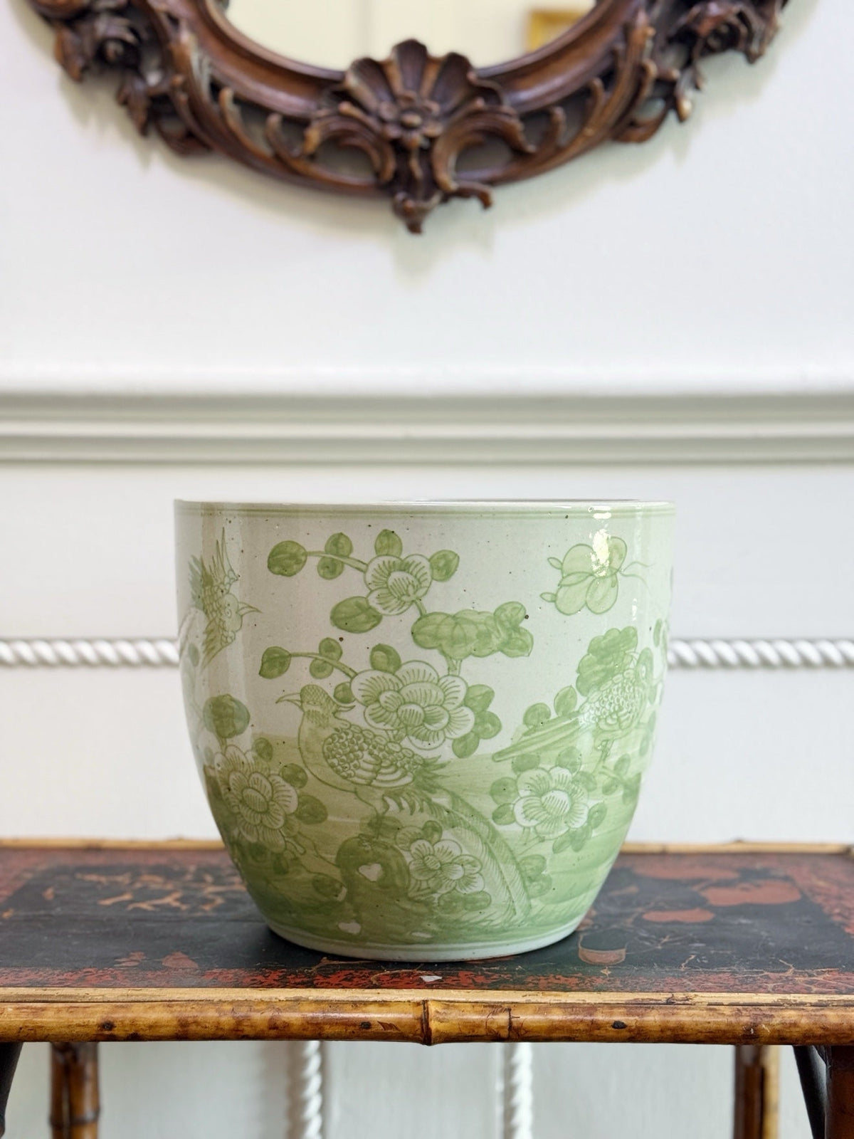 Green and white porcelain cachepot with bird and flower motif