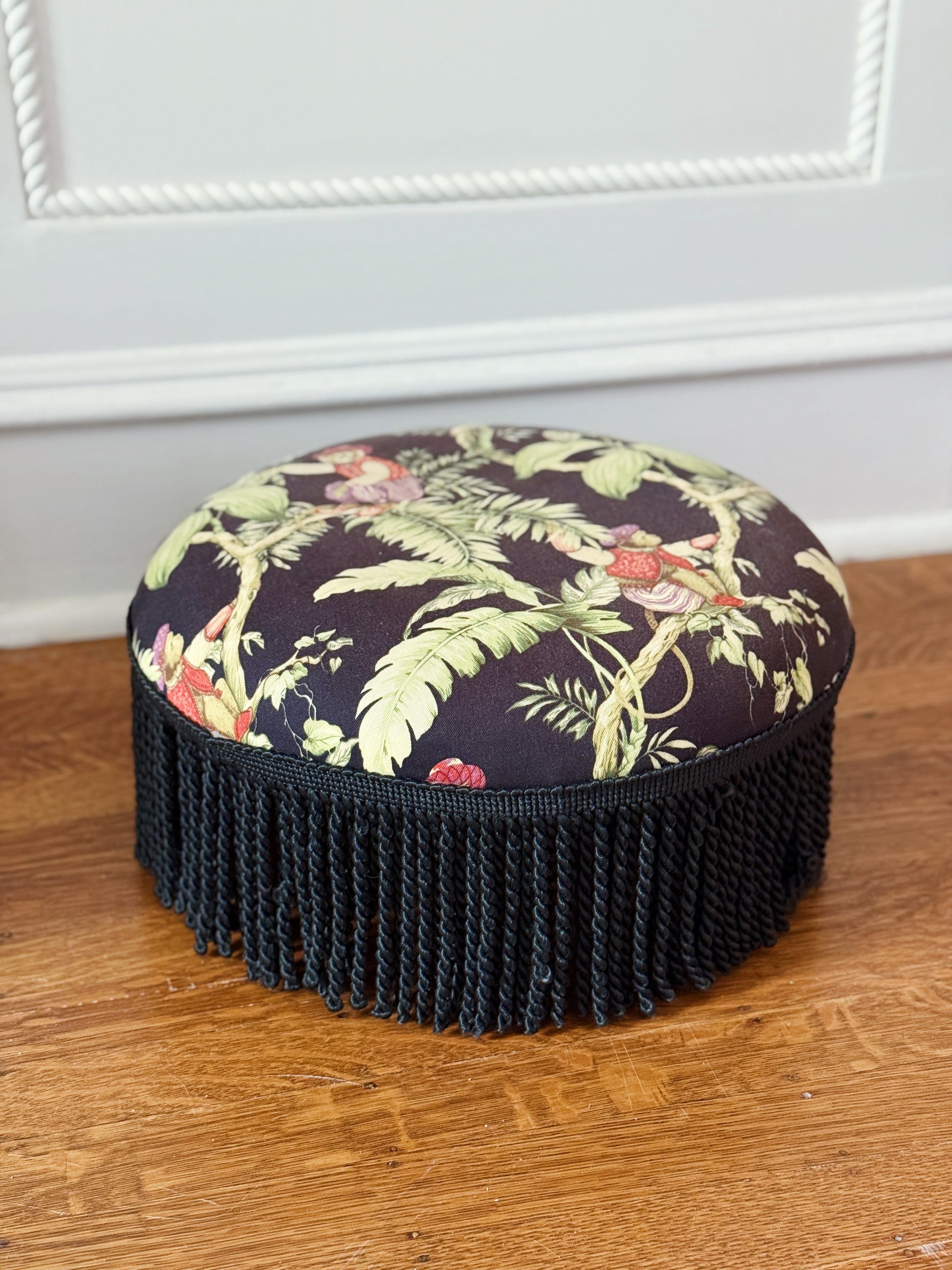Vintage furniture upholstered foot stool with tassel trim