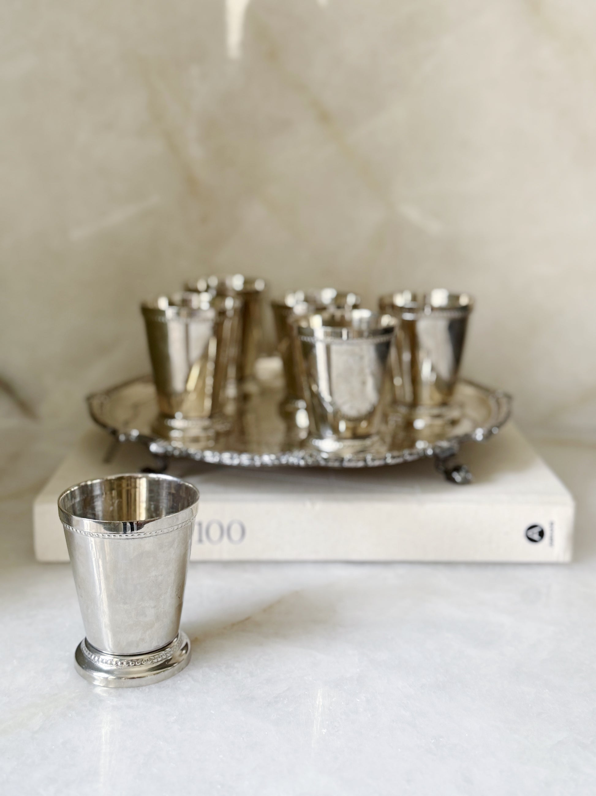 Vintage silver mint julep cups on an antique serving tray