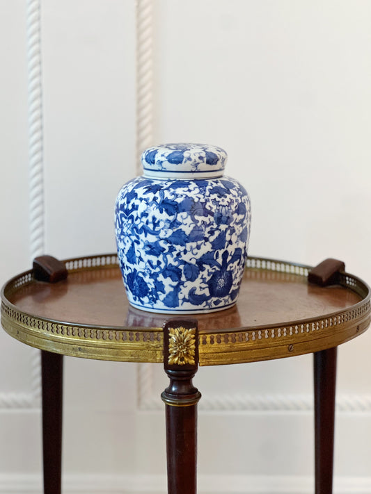 scrolling peonies blue and white ginger jar on wooden table