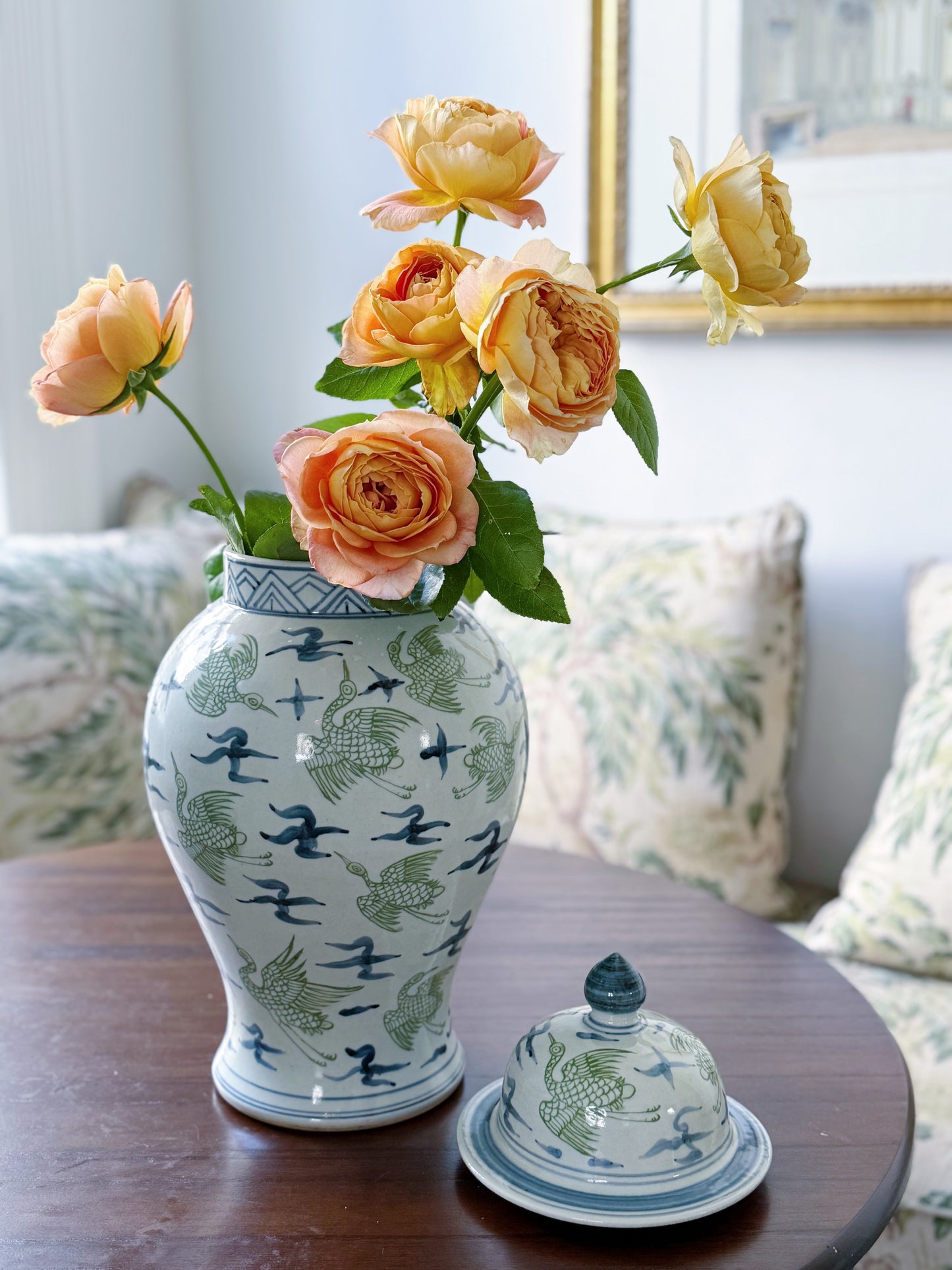 Blue and green crane temple jars with garden roses 