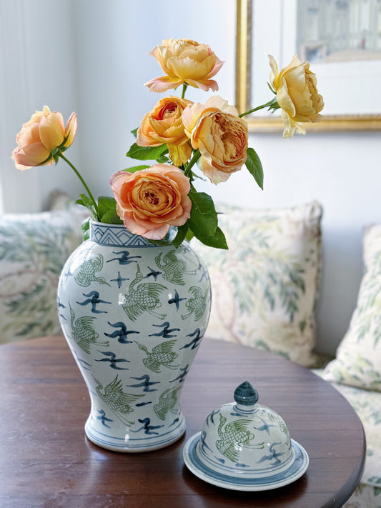 Blue and green crane temple jars with garden roses 