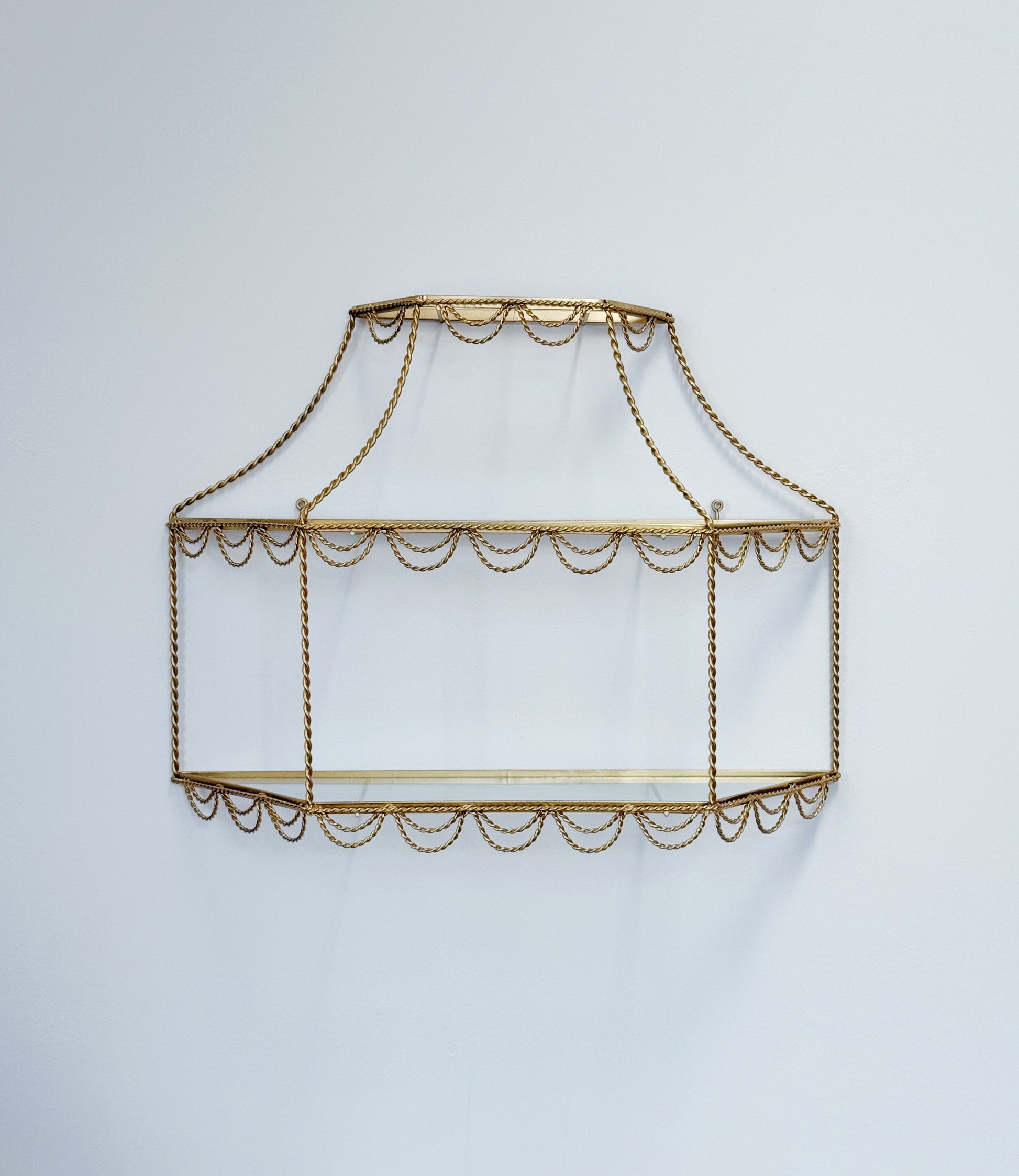 vintage Hollywood Regency gold and glass shelving with rope detail