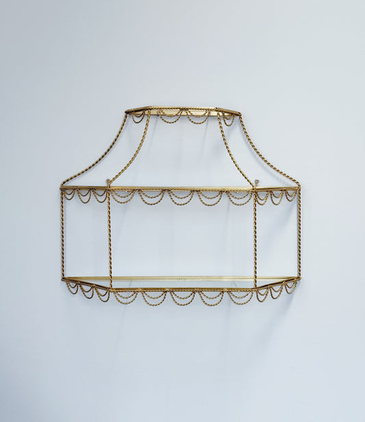 vintage Hollywood Regency gold and glass shelving with rope detail