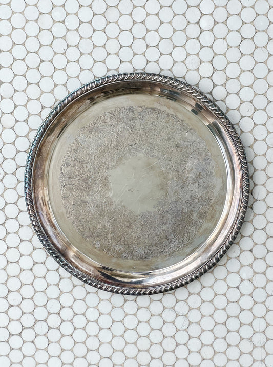large vintage silver serving tray with etched detail 