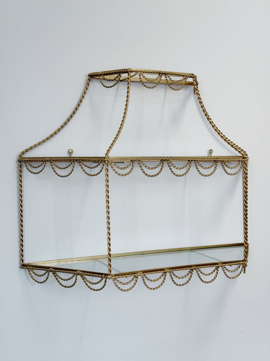 vintage Hollywood Regency gold and glass shelving with rope detail