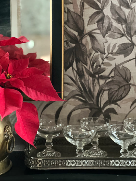 vintage anchor hocking bubble champagne coupes on a vintage silver serving tray