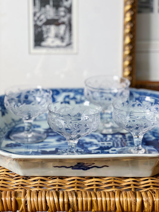 small vintage champagne coupes on a willow ware platter