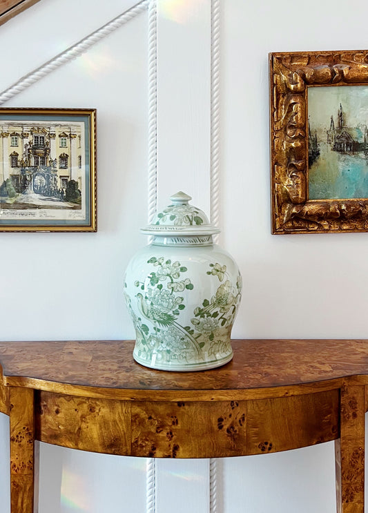 Green and white ginger jar on vintage furniture 