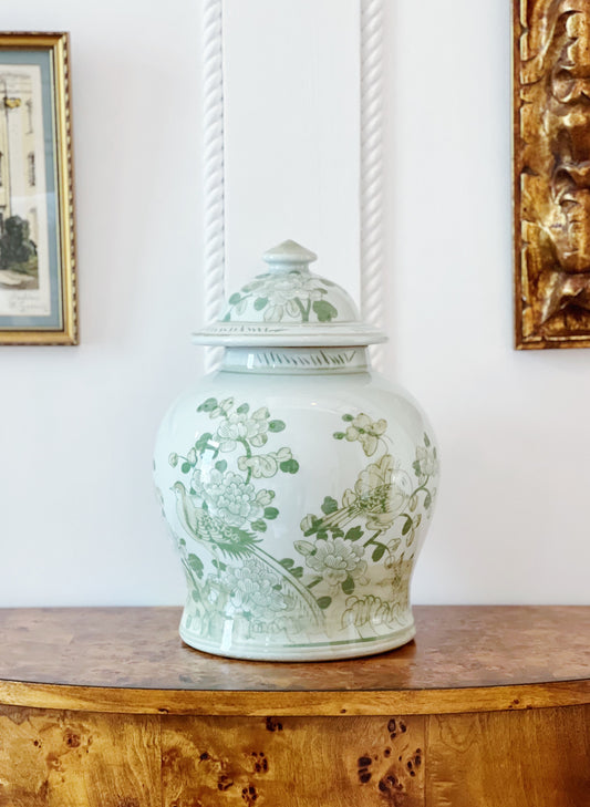 Green and white ginger jar on vintage furniture 