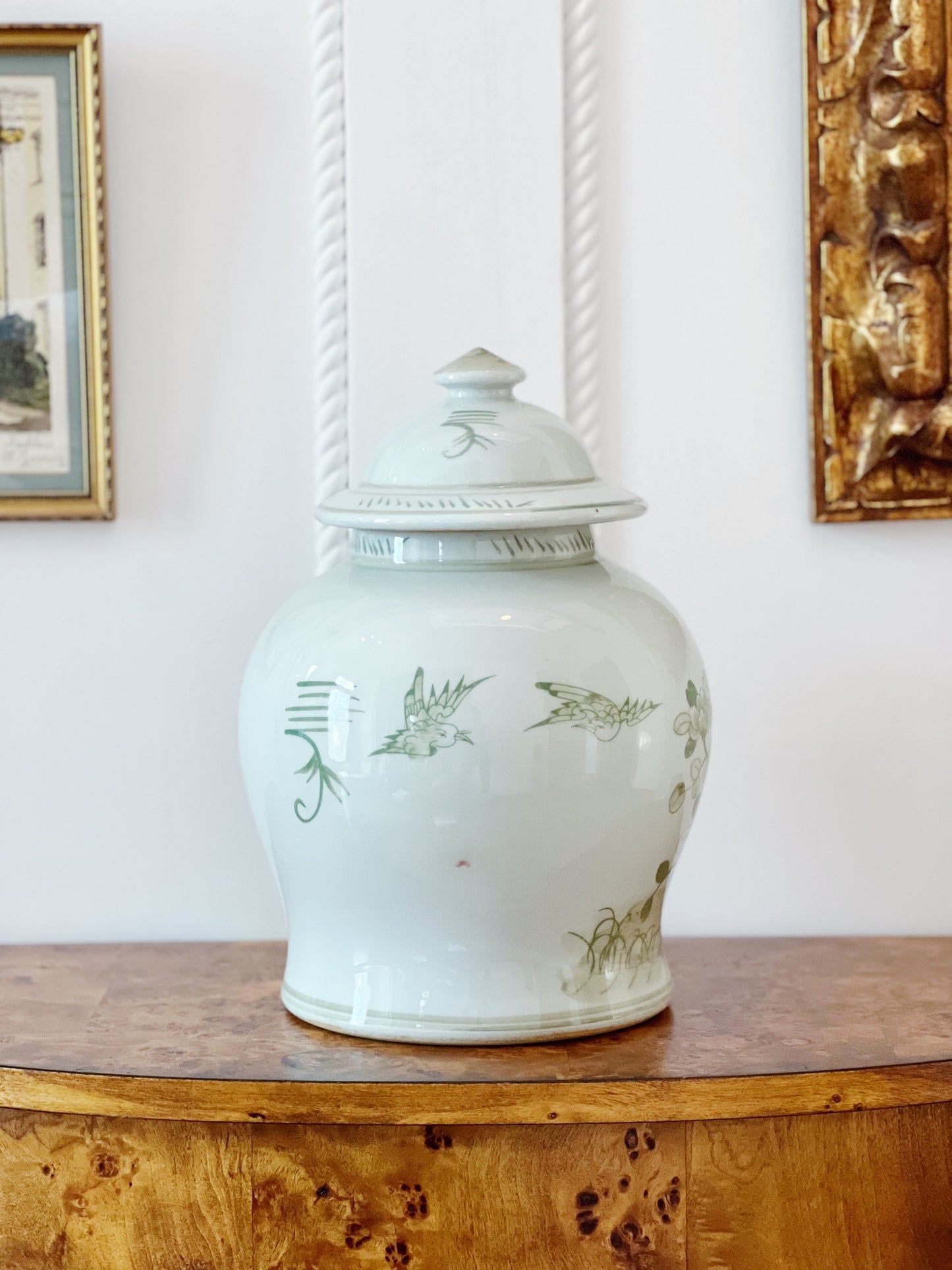 Green and white ginger jar on vintage furniture 
