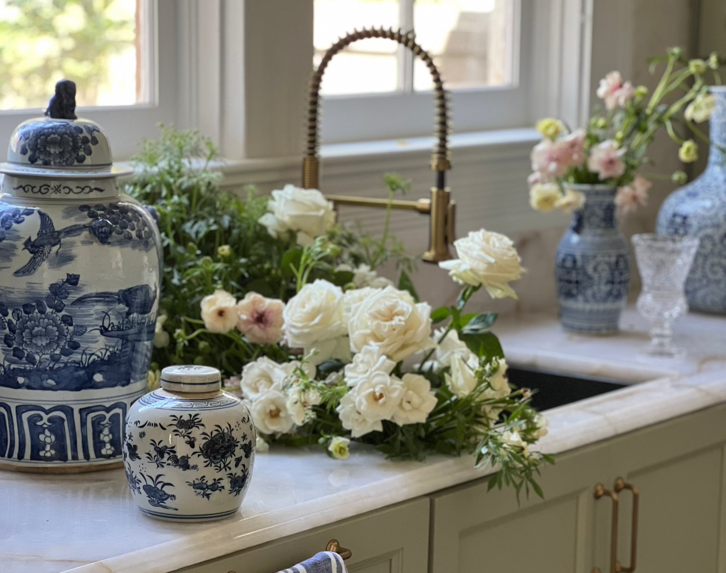 blue and white ginger jars, vintage home decor and flowers in a redesigned kitchen 