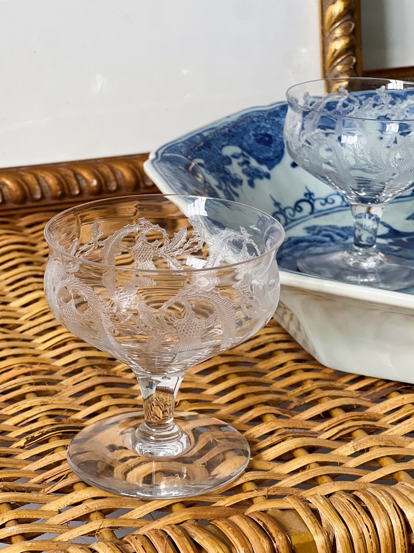 small champagne coupes on a willow ware platter