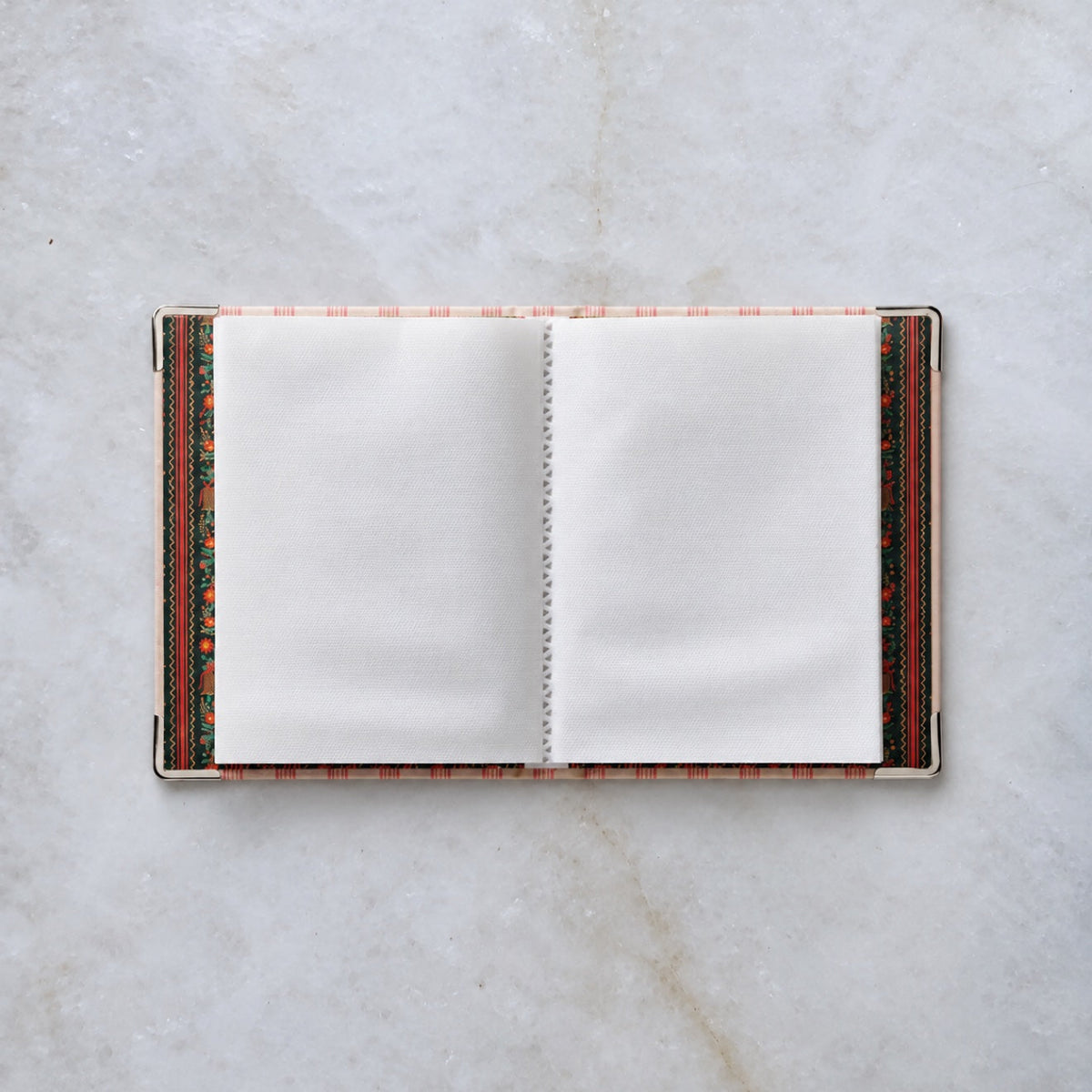Tinsel Tree embroidered photo album open, showing photo sleeve pages