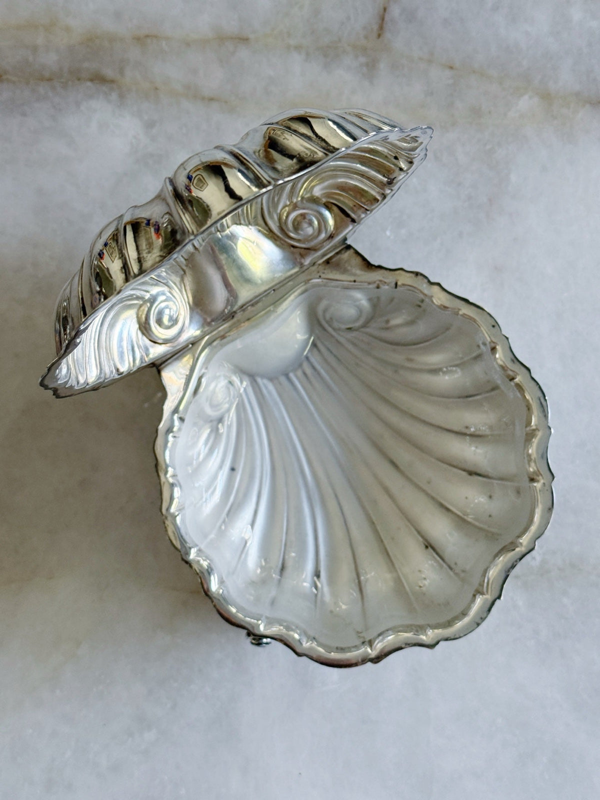 Vintage silver shell caviar dish with the frosted glass insert beside it