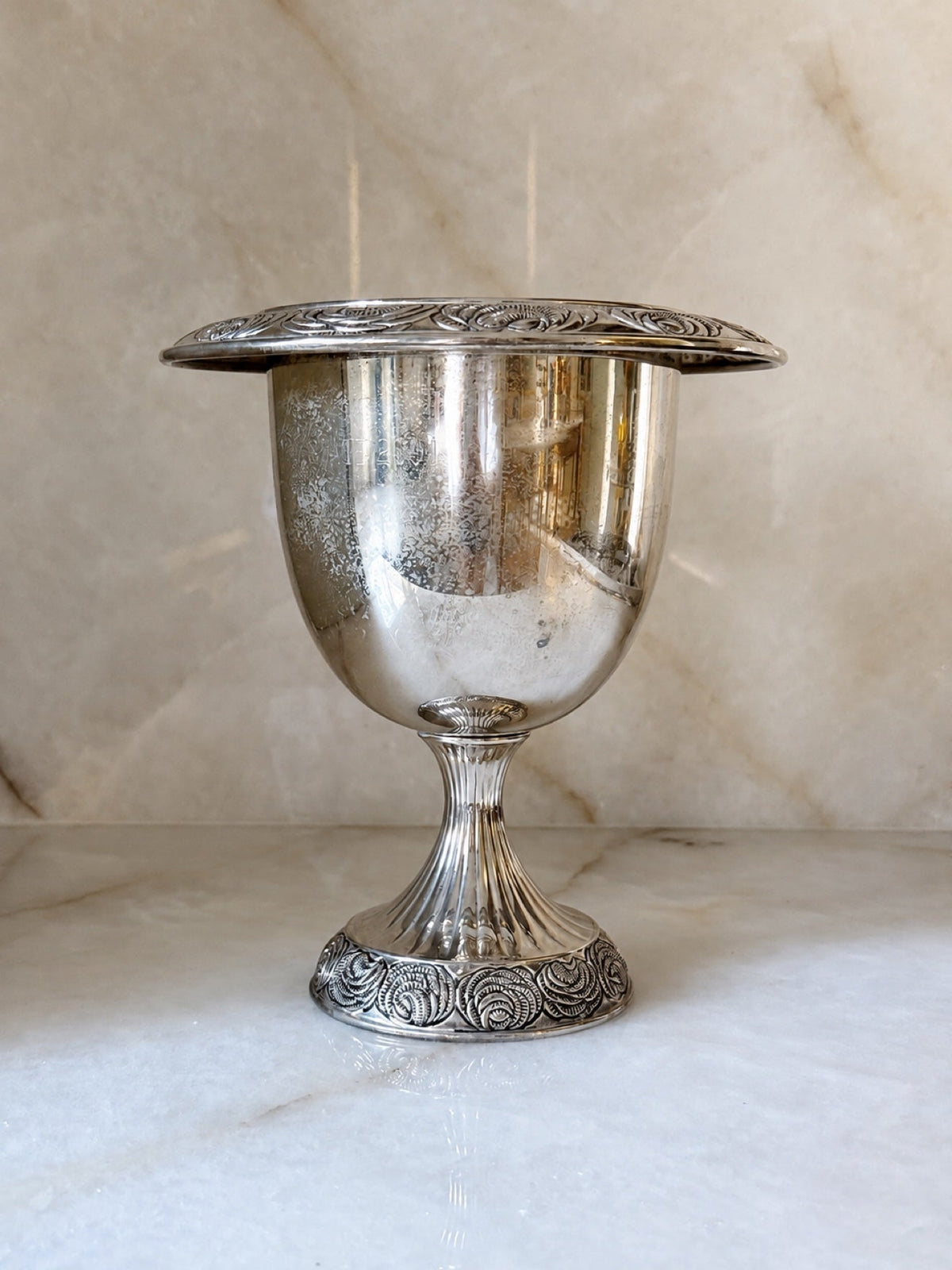 Vintage silver pedestal urn with rosette detailing, front view
