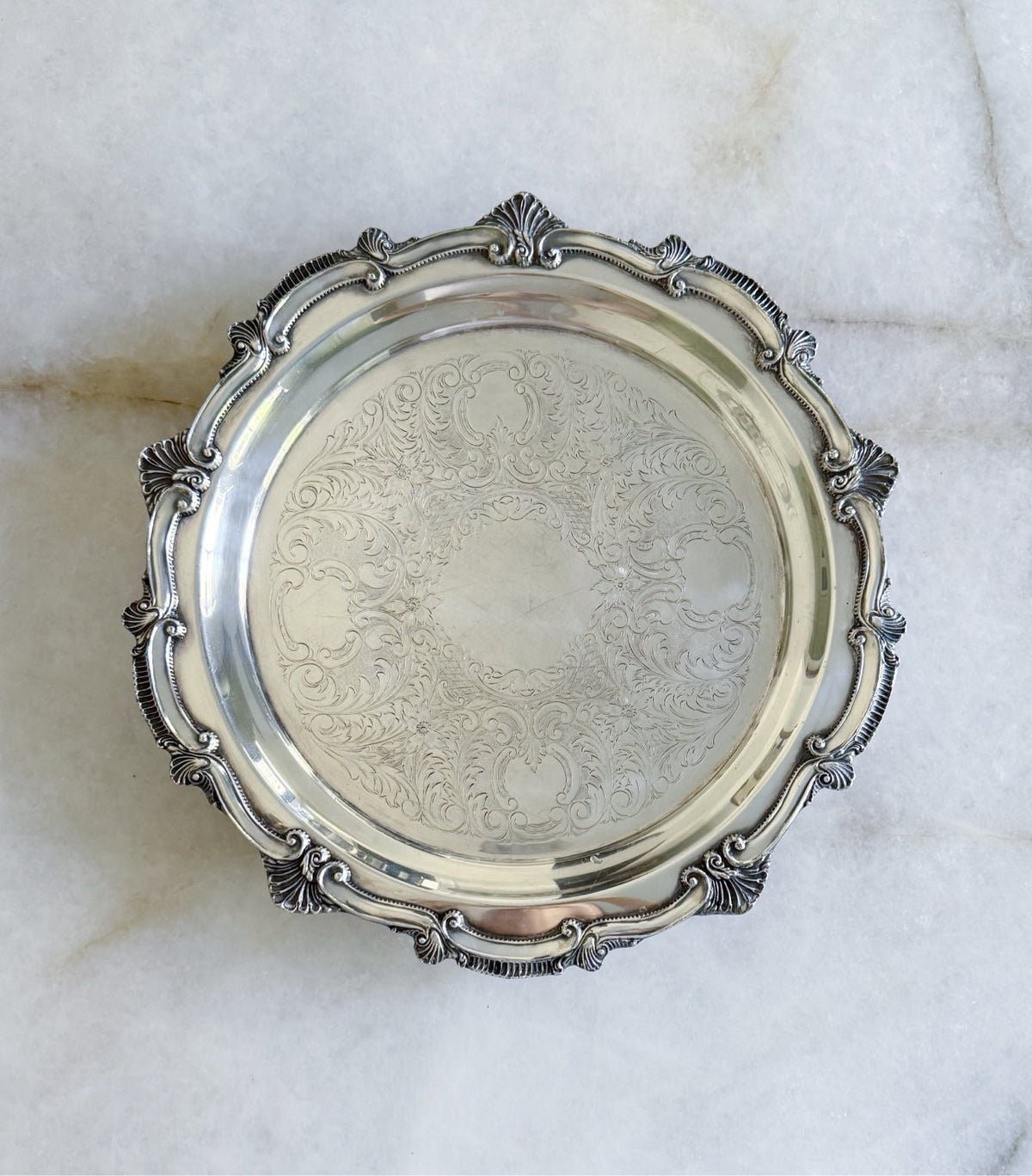 Top view of the vintage silver serving tray with embossed center