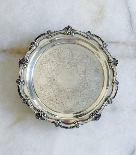 Top view of the vintage silver serving tray with embossed center